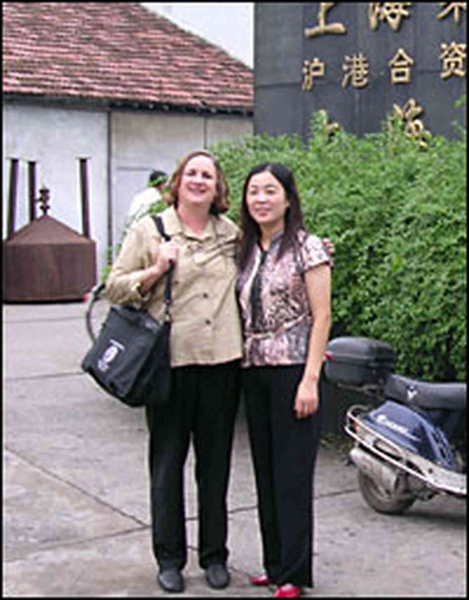 Author Pietra Rivoli stands with Tao Yong Fang, manager of a textile mill in Shanghai. Author Pietra Rivoli stands with Tao Yong Fang, manager of a textile mill in Shanghai.