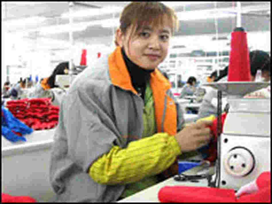 A seamstress in a Shanghai textile factory. A seamstress in a Shanghai textile factory.
