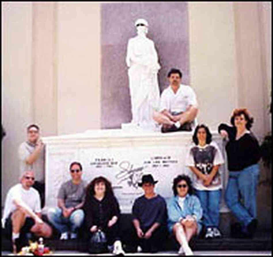 Members of Hollywood Underground pose at the tomb of Liberace. Members of Hollywood Underground pose at the tomb of Liberace.
