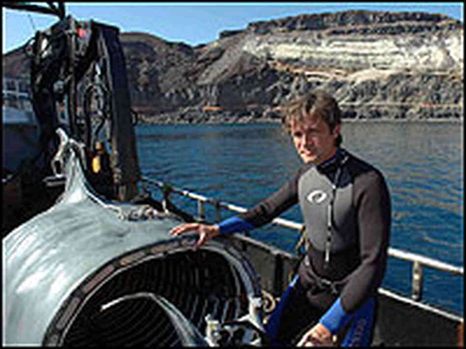 Fabien Cousteau in a wetsuit aboard his boat. Fabien Cousteau in a wetsuit aboard his boat.