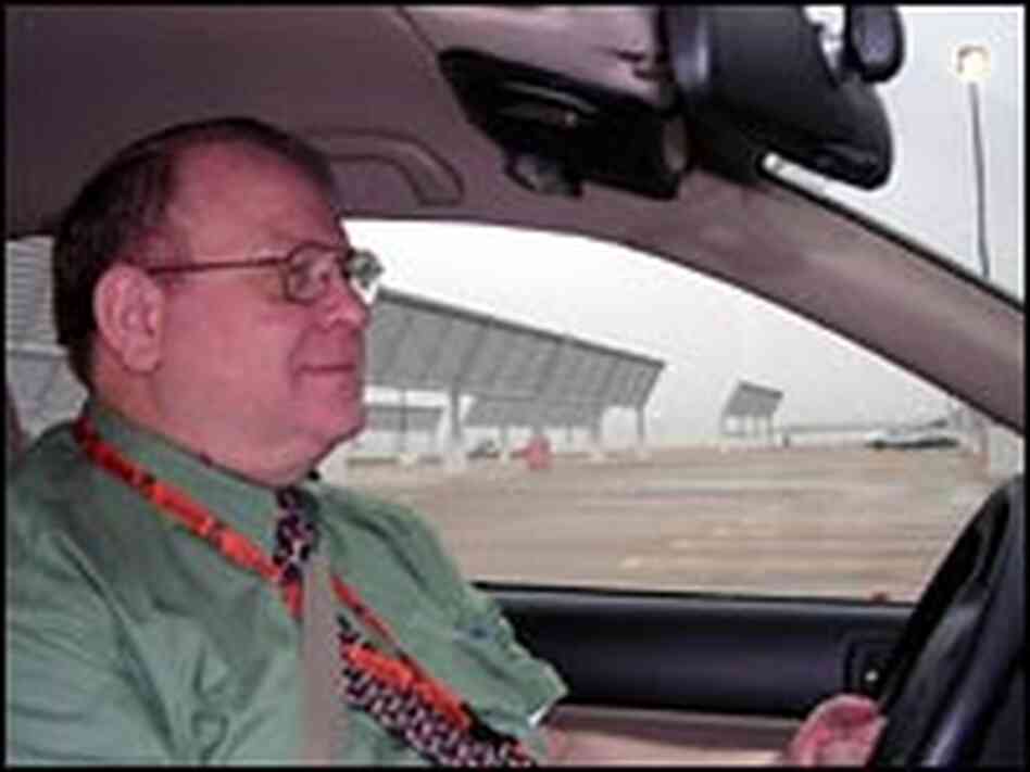 Dick Cole drives his hybrid auto. Dick Cole drives his hybrid auto.