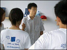 Li Dan discusses AIDS-related issues with fellow volunteers. Li Dan discusses AIDS-related issues with fellow volunteers.