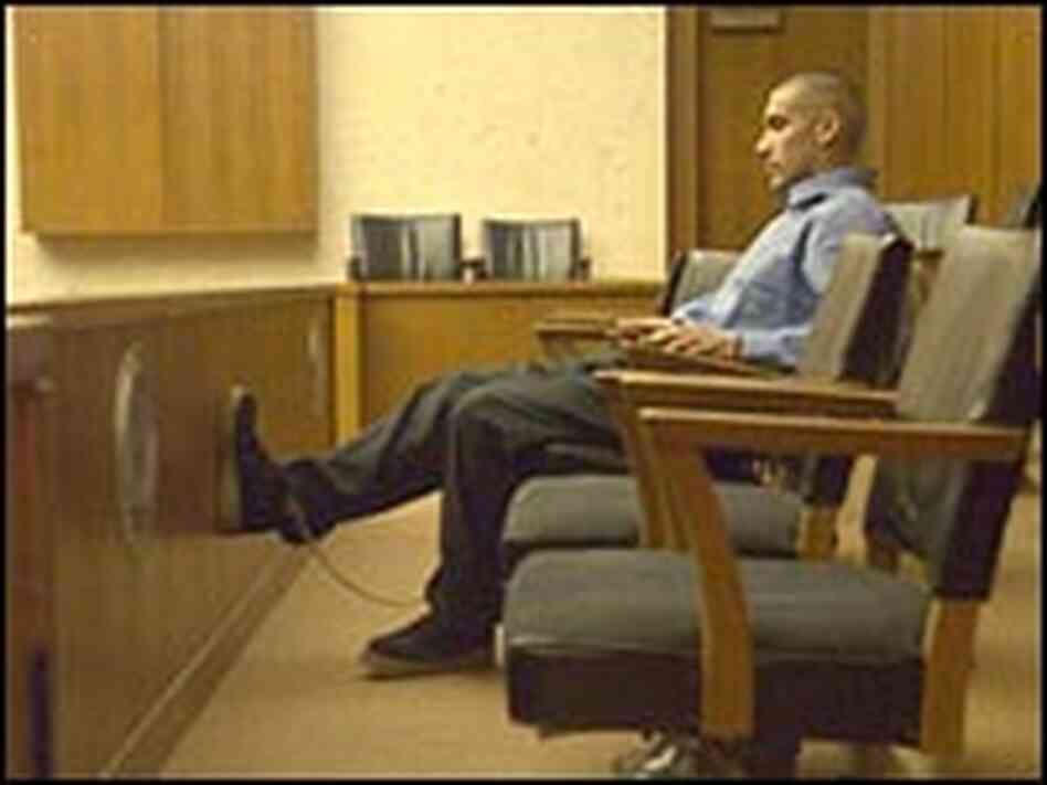 Armando Frías waits in a courtroom. Armando Frías waits in a courtroom.