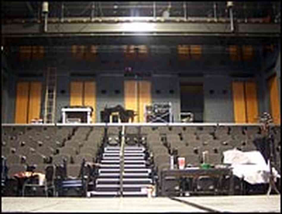 The theater has dozens of double-doors and hundreds of small square holes in the concrete walls. The theater has dozens of double-doors and hundreds of small square holes in the concrete walls.