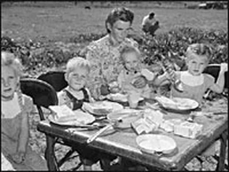 A mother and her children eat breakfast after the 1953 Short Creek raid. A mother and her children eat breakfast after the 1953 Short Creek raid.
