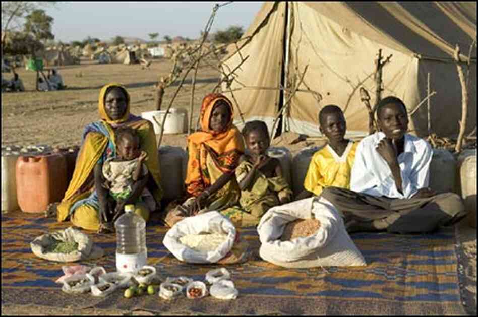 The Aboubakar family of Darfur province, Sudan, in front of their tent in the eastern Chad. The Aboubakar family of Darfur province, Sudan, in front of their tent in the eastern Chad.