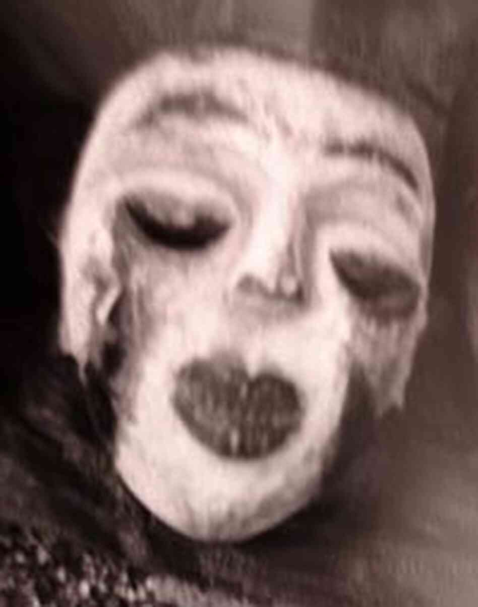 Photo of a mask taken with a toy camera, with distinctive "light leak" highlights