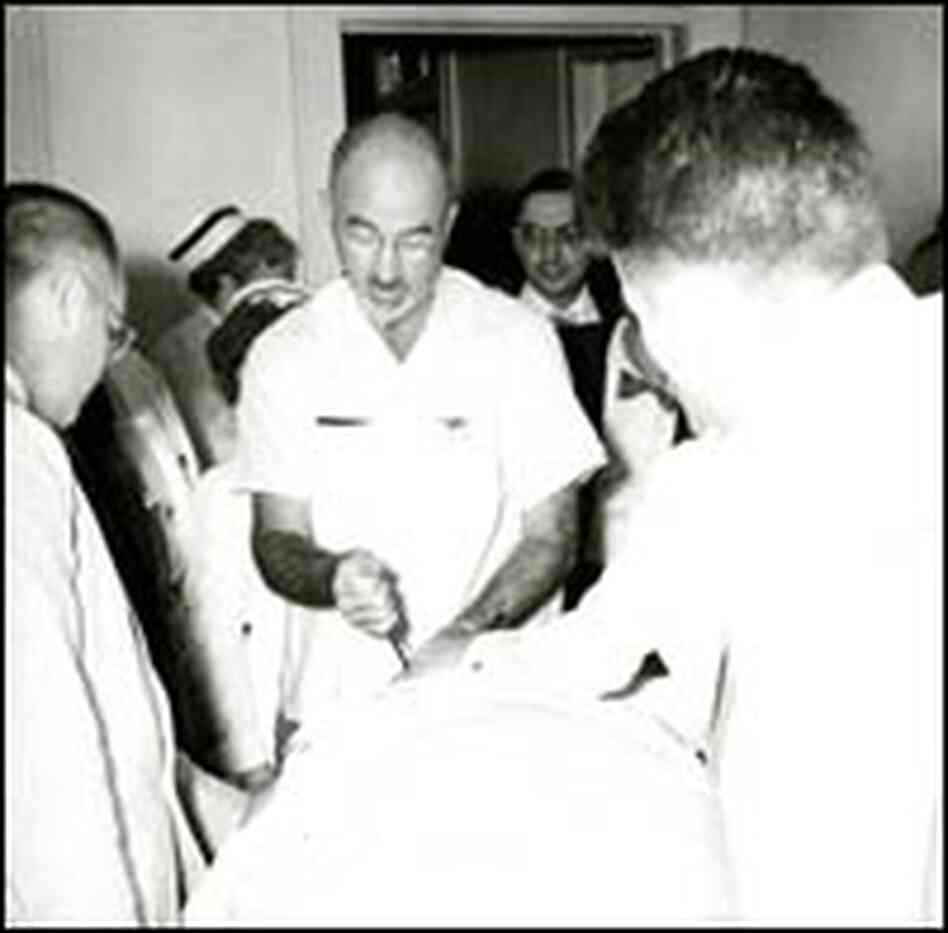 Dr. Walter Freeman operating on a patient, c. 1950. Dr. Walter Freeman operating on a patient, c. 1950.