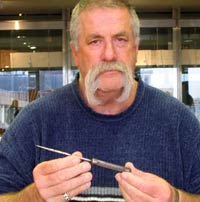 Howard Dully holding one of Dr. Walter Freeman's original ice picks, January 2004. 