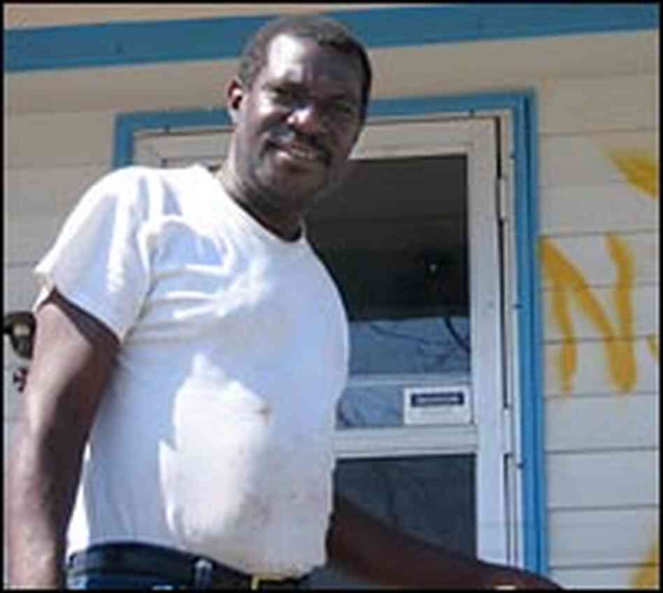 Resident Kelvin Joseph oustide his home Resident Kelvin Joseph oustide his home