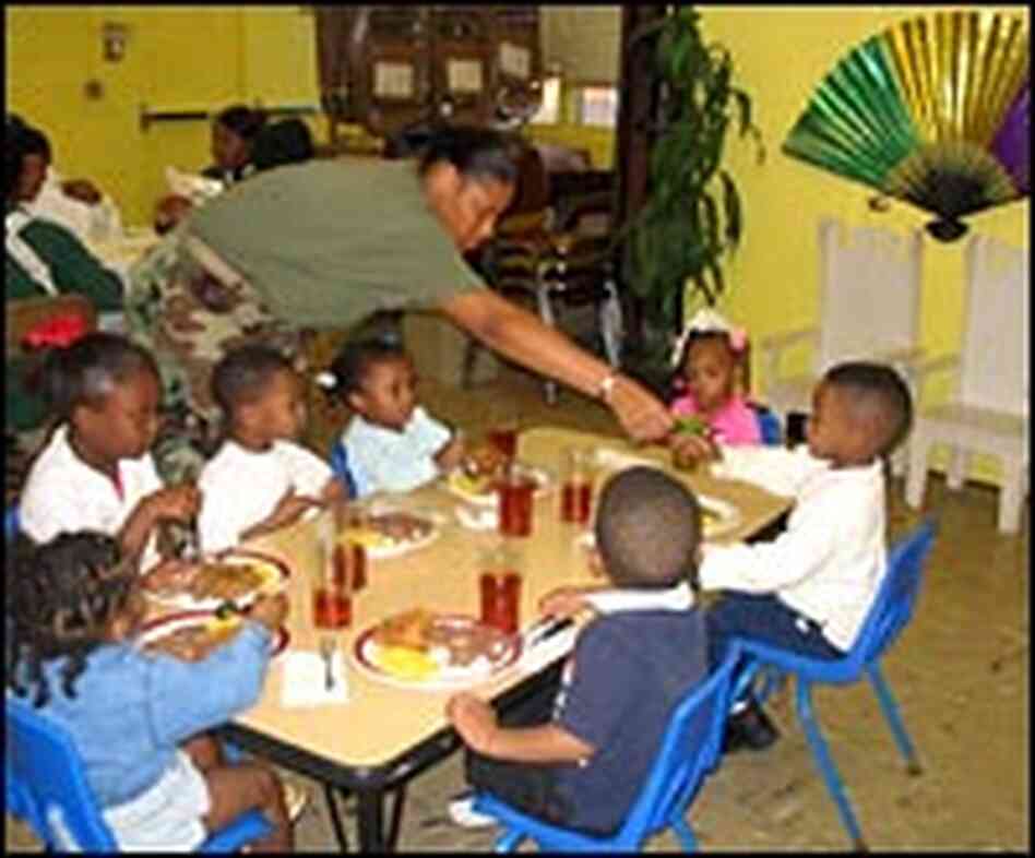 Serving children food at the Kids Cafe