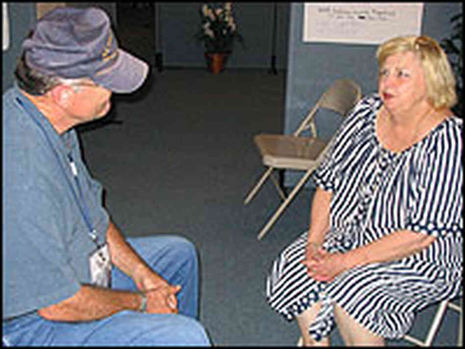 Kathy Hurley Asher of Waveland, Mississippi, seeks solace in the "Vent Tent" from Dr. Thomas Peavy. Kathy Hurley Asher of Waveland, Mississippi, seeks solace in the "Vent Tent" from Dr. Thomas Peavy.