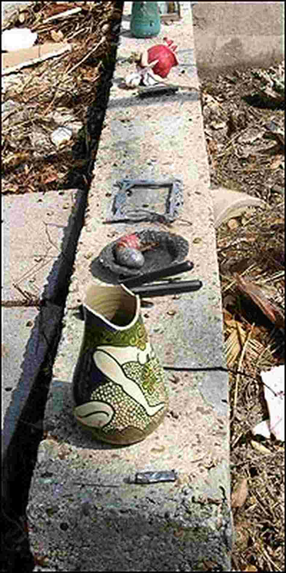 Pottery left intact by the storm decorates a seawall at Shearwater. Pottery left intact by the storm decorates a seawall at Shearwater.