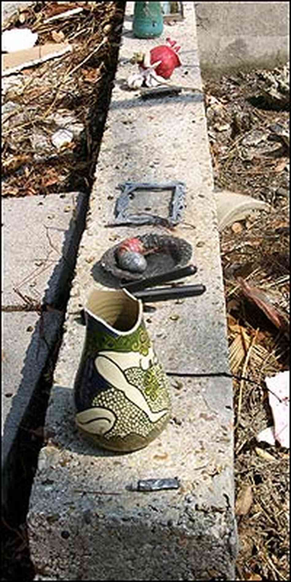 Pottery left intact by the storm decorates a seawall at Shearwater. Pottery left intact by the storm decorates a seawall at Shearwater.