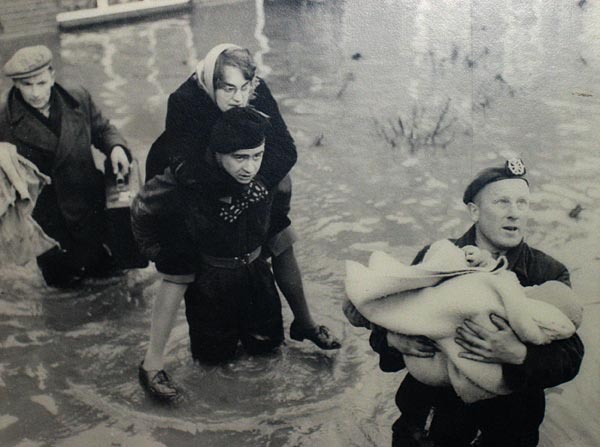 Dutch soldiers help evacuate flooded areas after a storm burst miles of levees in 1953.