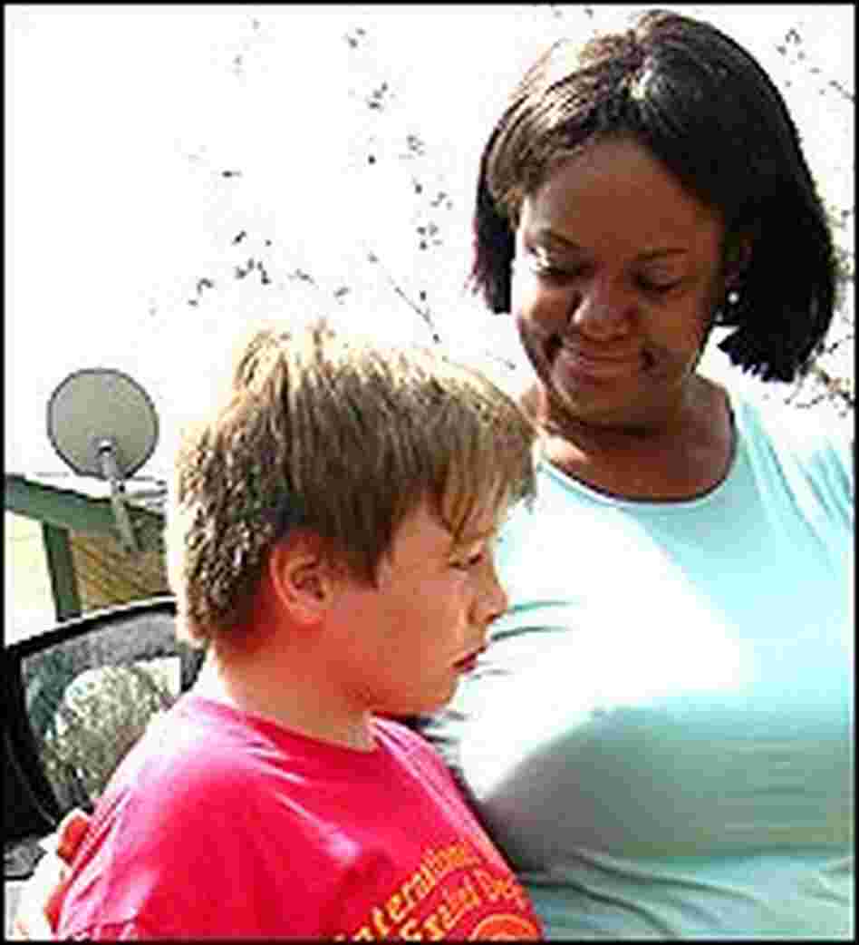 Dr. Regina Benjamin tends to 10-year-old Jamis Shultz. Dr. Regina Benjamin tends to 10-year-old Jamis Shultz.