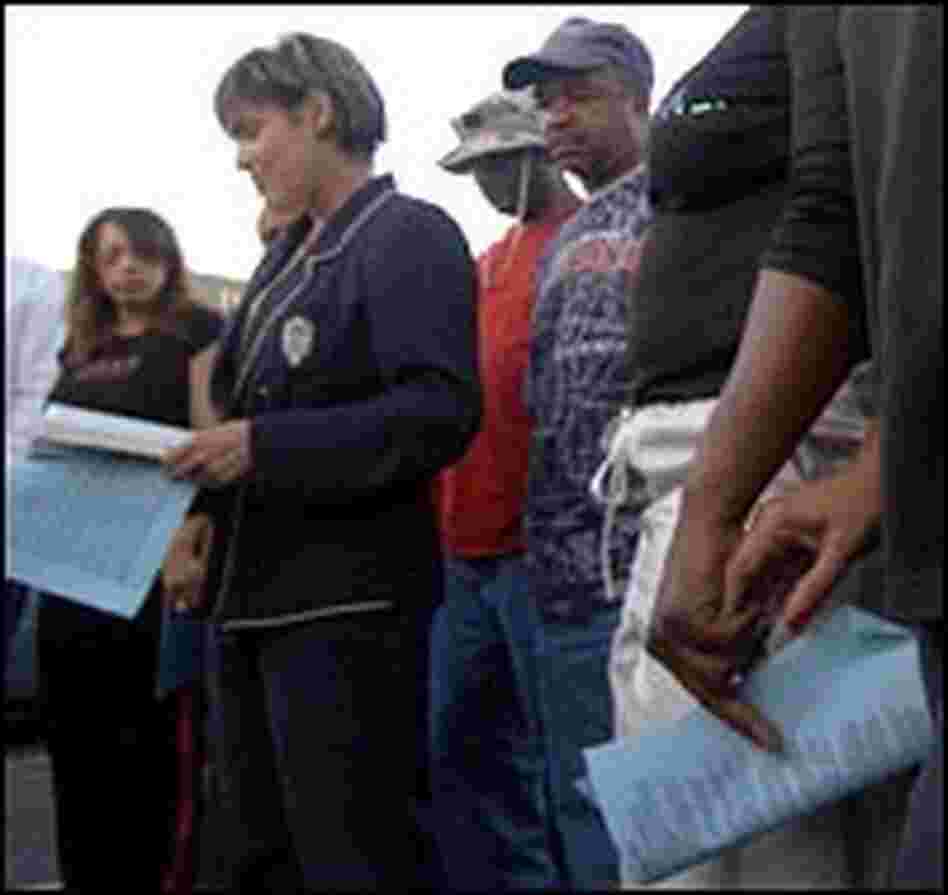 City Councilwoman Cynthia Willard-Lewis prays with New Orleans East residents.