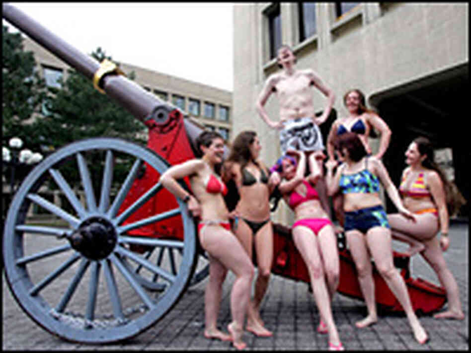Bikini-clad members of a group calling themselves the "Cannon College Co-Ed's" gather around. Bikini-clad members of a group calling themselves the "Cannon College Co-Ed's" gather around.