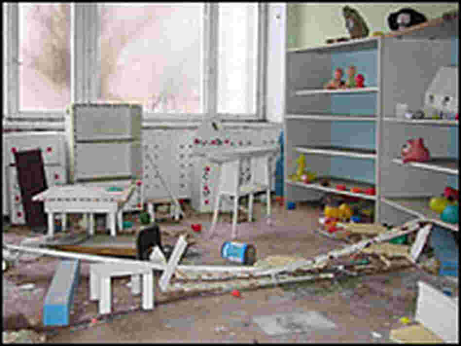 Toys and furniture strewn on the floor of an abandoned nursery in Pripyat