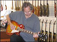 Gil Southworth strums a Gibson Les Paul Sunburst
