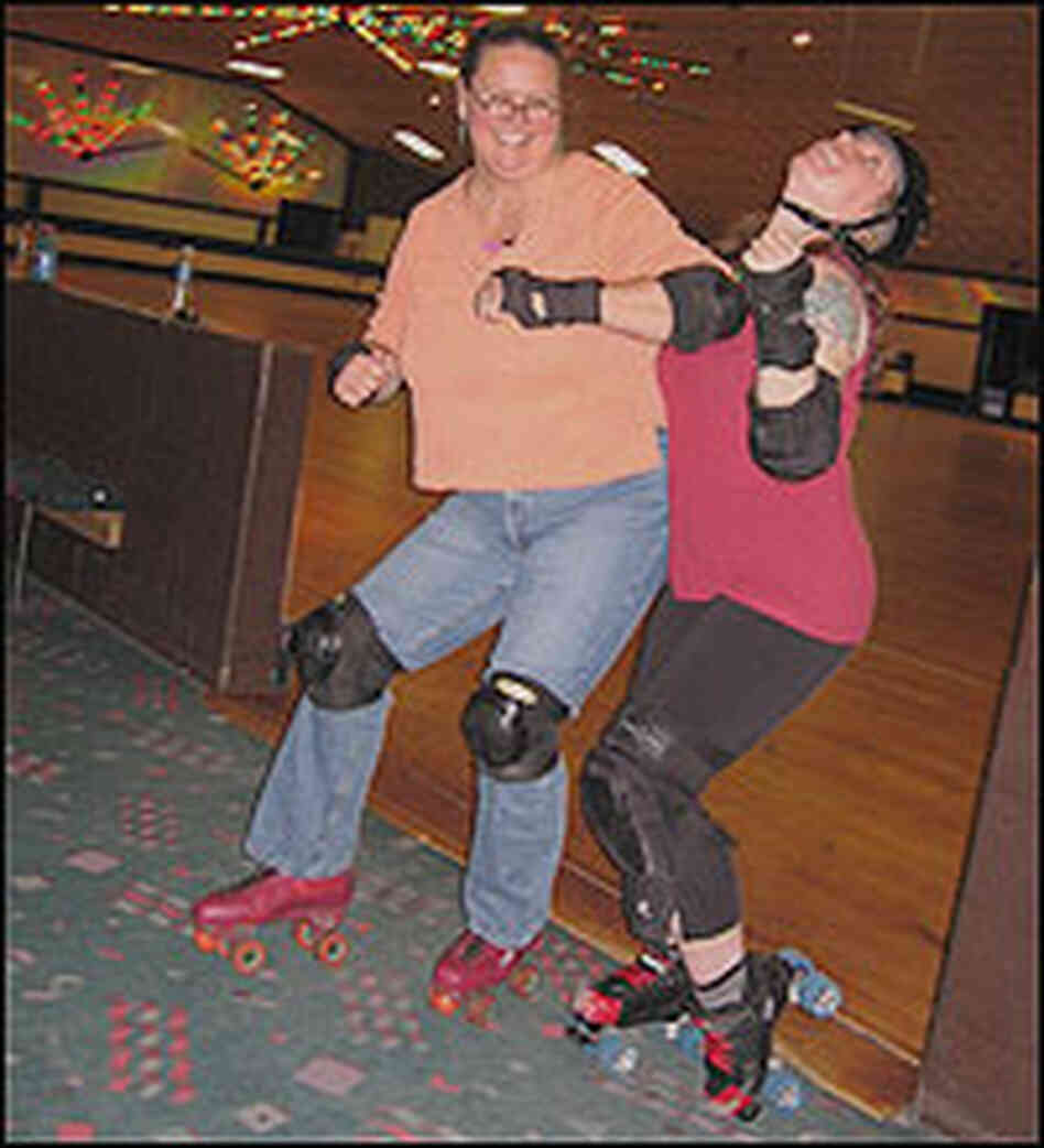 Debbie Elliott pretends to elbow a Charm City Roller Girl.