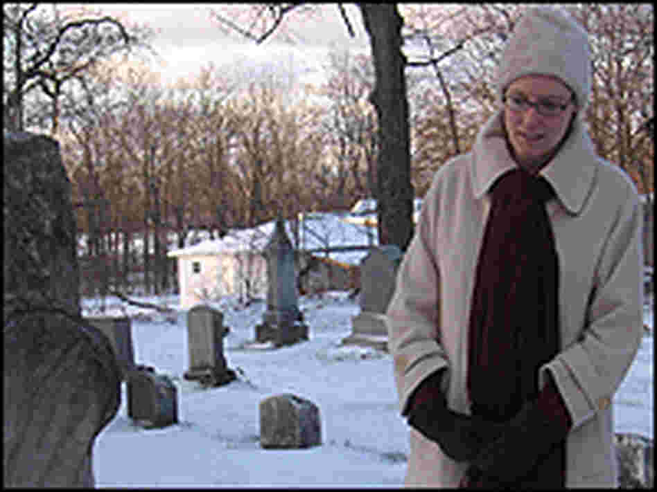 Historian Anna-Lisa Cox at dusk in the Covert cemetery.