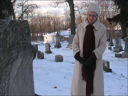 Historian Anna-Lisa Cox at dusk in the Covert cemetery.