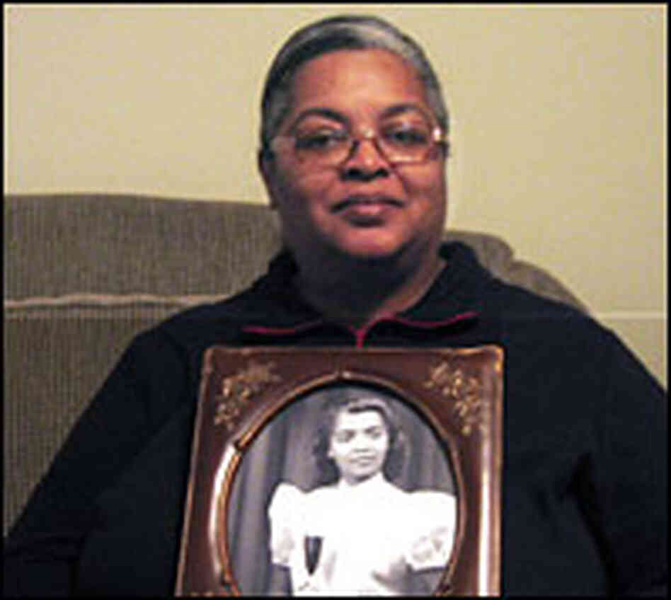 Angela McManus, 48, holds a photo of her mother.