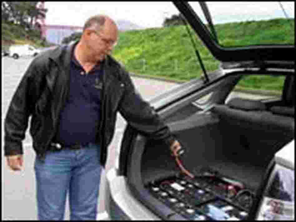 Ron Gremban shows off the power cord and extra batteries on his 'hacked' '04 Prius Ron Gremban shows off the power cord and extra batteries on his 'hacked' '04 Prius