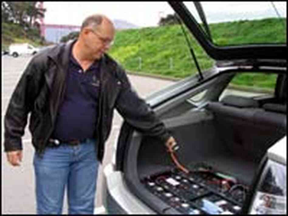 Ron Gremban shows off the power cord and extra batteries on his 'hacked' '04 Prius Ron Gremban shows off the power cord and extra batteries on his 'hacked' '04 Prius