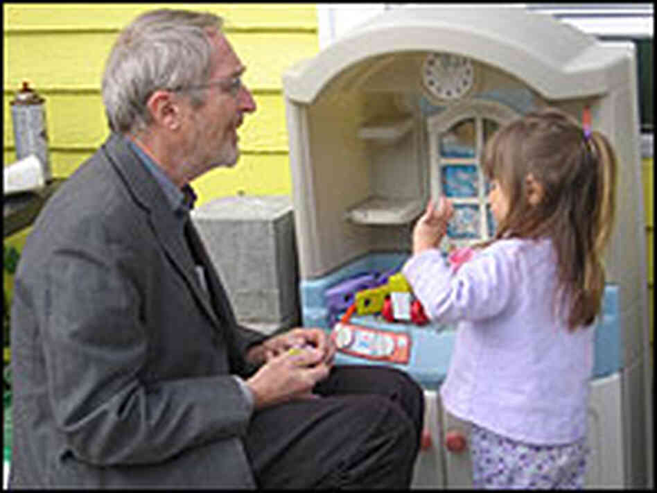 Analia Reutter plays with Professor Howard Mielke in her backyard. Analia Reutter plays with Professor Howard Mielke in her backyard.