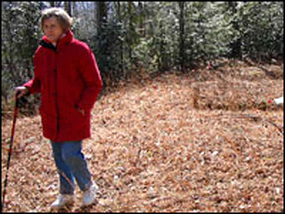 Peggy Medford explores an old graveyard on land her family once owned. 