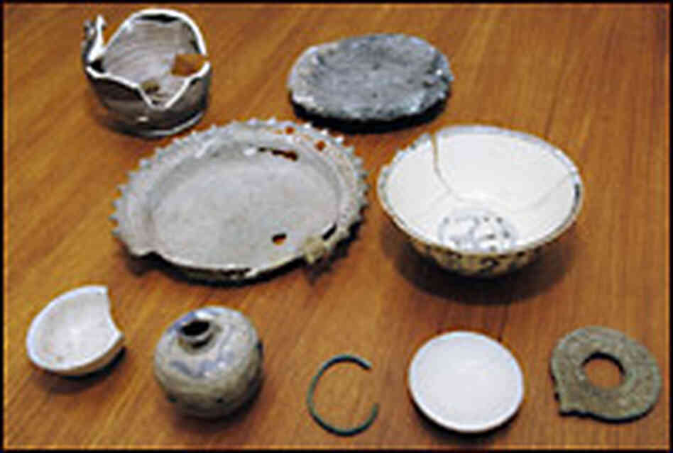 Artifacts from Tambora include ceramic pots, bronze bowls, iron tools and a bracelet.