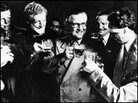 McIndoe joins his patients for a drink. McIndoe joins his patients for a drink.