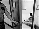 An inmate sits in his solitary confinement cell in a prison in Huntsville, Texas, in this file photo An inmate sits in his solitary confinement cell in a prison in Huntsville, Texas, in this file photo