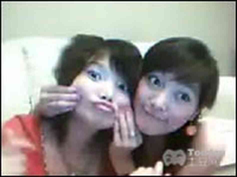 A popular video download features two girls lip-synching a song. A popular video download features two girls lip-synching a song.
