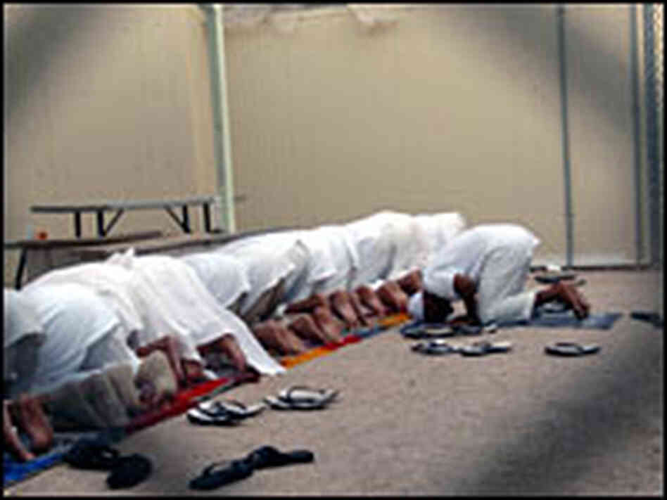 Detainees pray Detainees pray