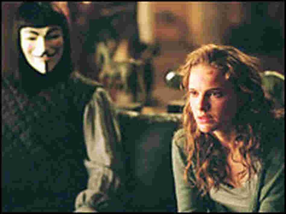 Evey (Natalie Portman) with the masked vigilante known only as V (Hugo Weaving).