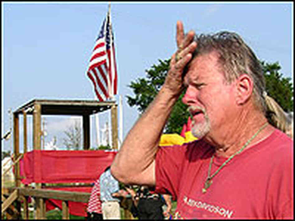 Bubba Bryant puts his palm to his forehead at the blessing of the fleet. Bubba Bryant puts his palm to his forehead at the blessing of the fleet.