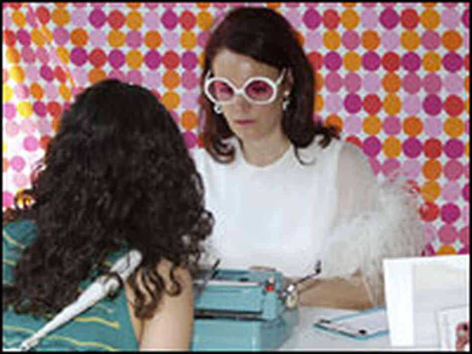 Sheryl Oring helps Dena Qaddumi Sheryl Oring helps Dena Qaddumi