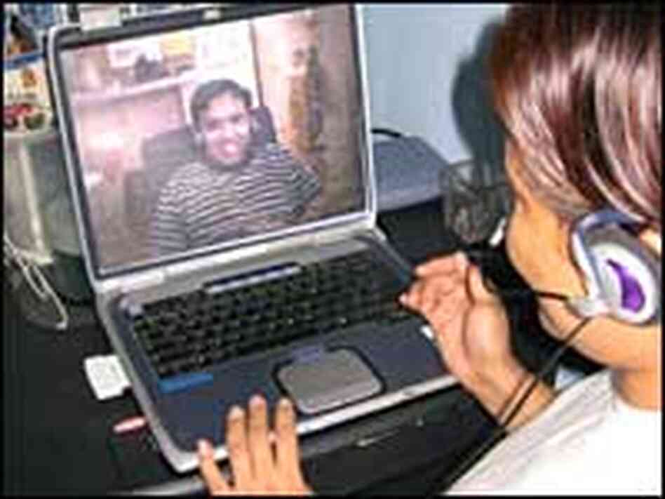 Ana Sanchez Lobo and her husband communicate regularly through a Web cam link. Ana Sanchez Lobo and her husband communicate regularly through a Web cam link.