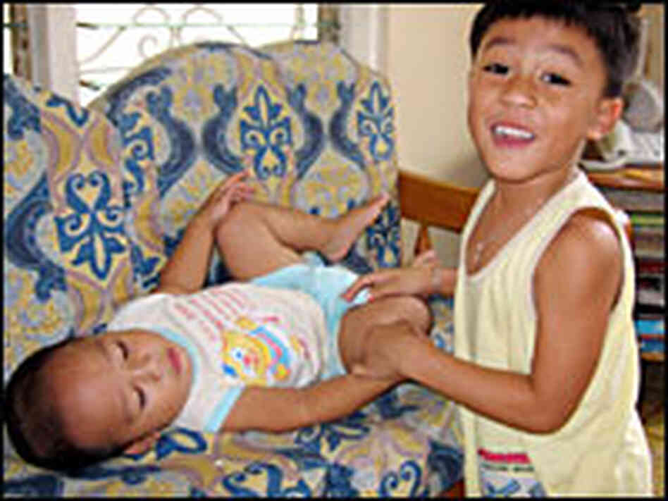 Patrick Lobo, 5, plays with his younger brother, Tristan. Patrick Lobo, 5, plays with his younger brother, Tristan.