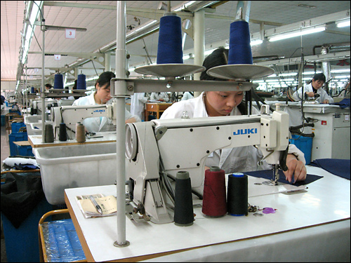 This textile factory and others like it are behind the wealth of Huaxi's original residents. 