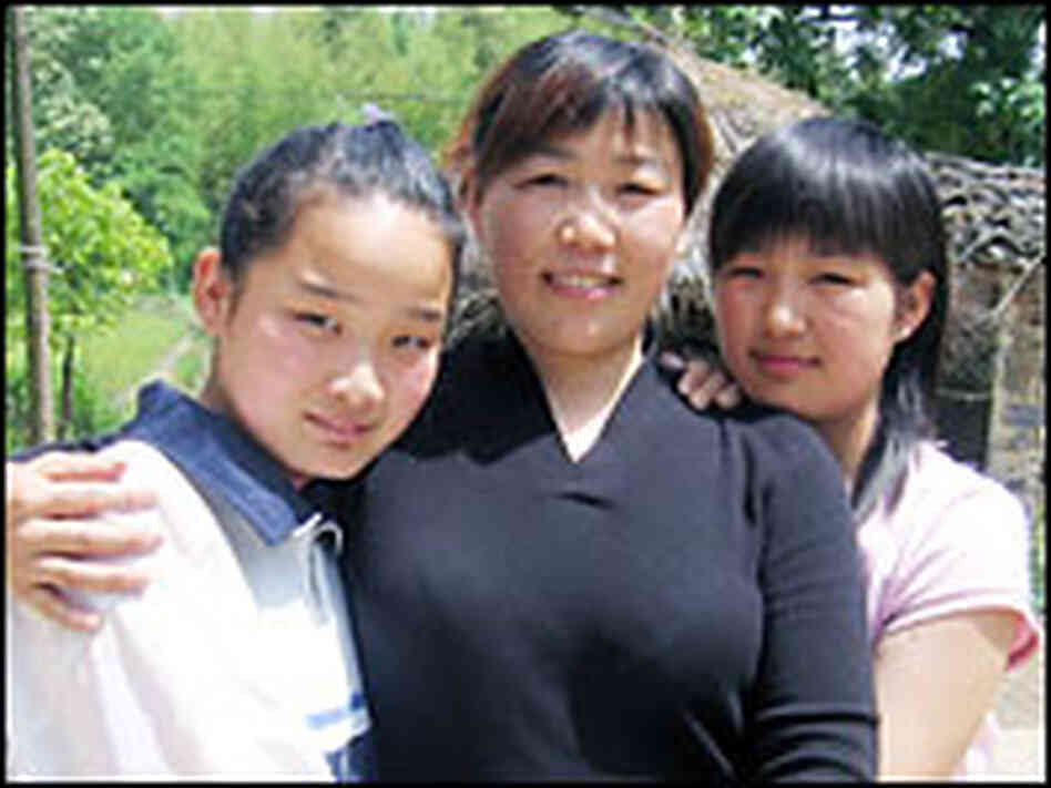 Wu Dexiu has lived apart from her daughters, Tang Deyun, left, and Tang Shanshan for nine years. Wu Dexiu has lived apart from her daughters, Tang Deyun, left, and Tang Shanshan for nine years.