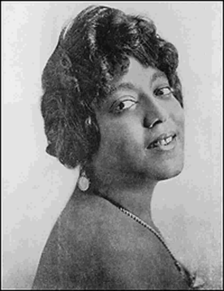 A studio headshot portrait of American blues singer Mamie Smith, taken about 1923.