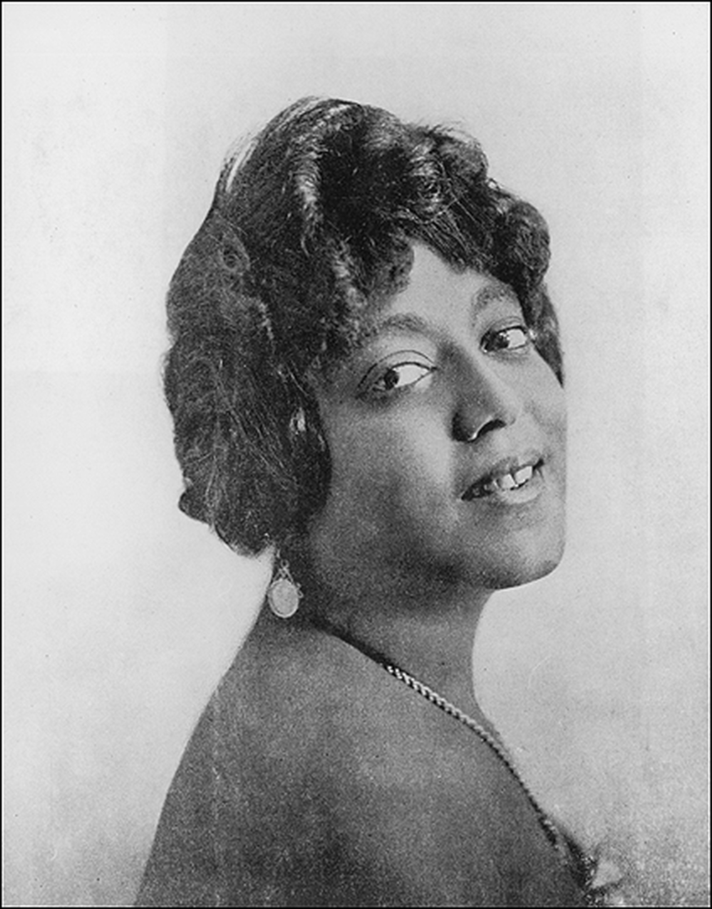 A studio headshot portrait of American blues singer Mamie Smith, taken about 1923.