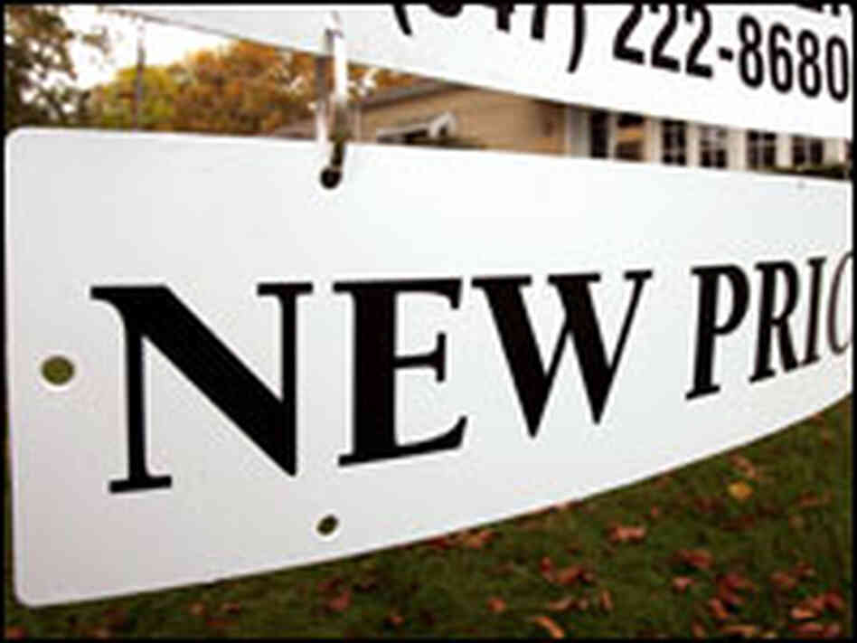 A real-estate sign announces "New Price" A real-estate sign announces "New Price"
