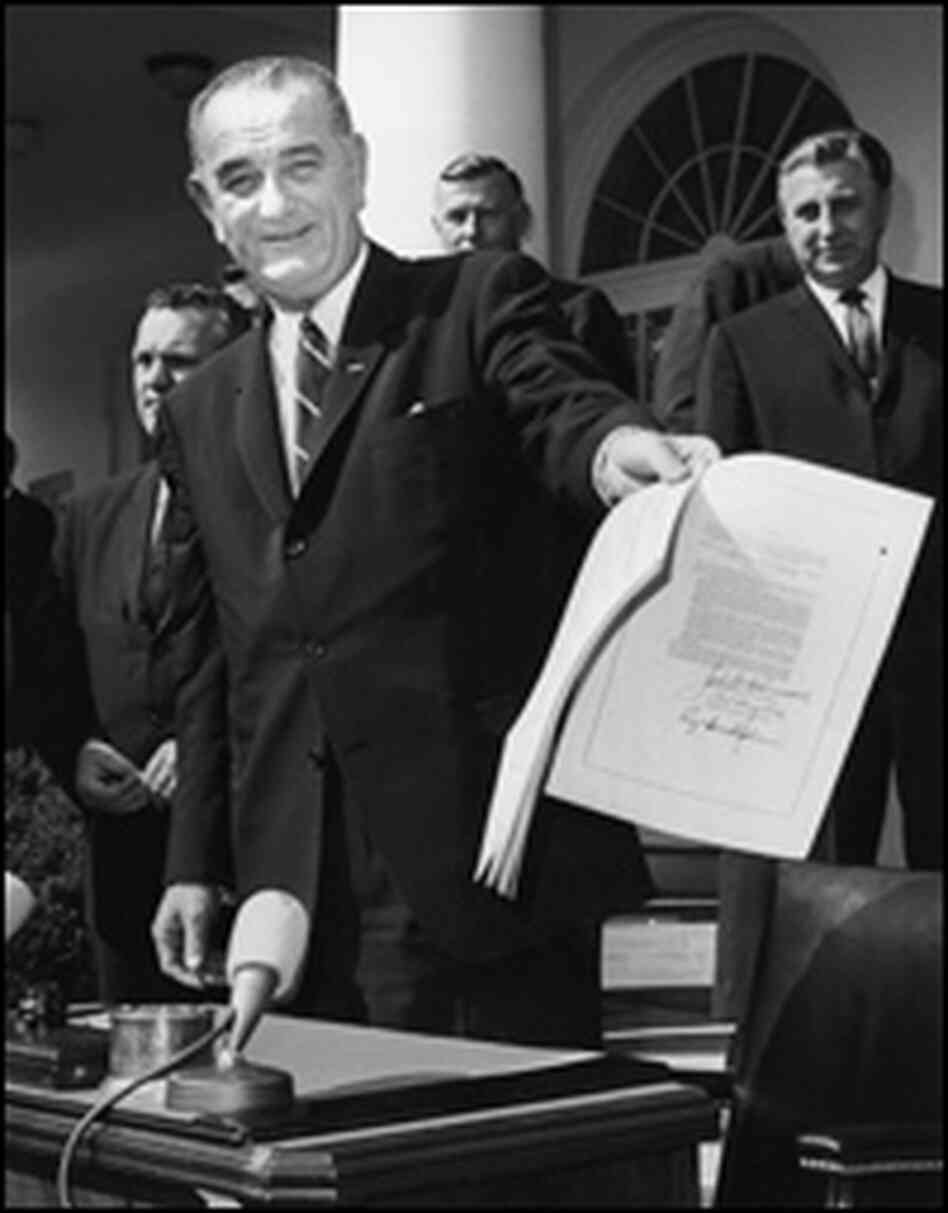 President Lyndon Johnson signing a bill President Lyndon Johnson signing a bill