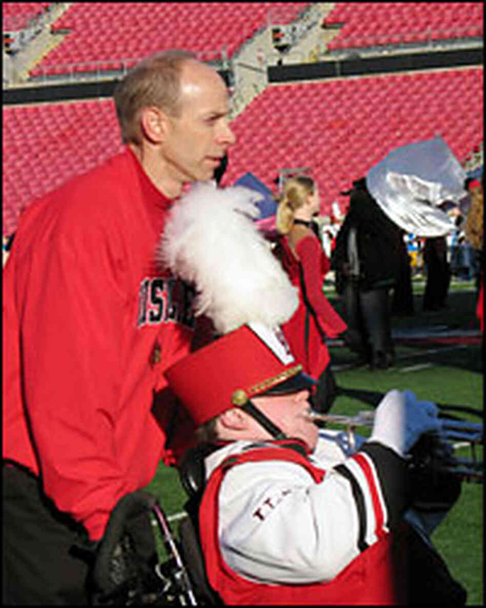 Patrick John Hughes (left) pushes the wheelchair of his son, Patrick Henry Hughes Patrick John Hughes (left) pushes the wheelchair of his son, Patrick Henry Hughes