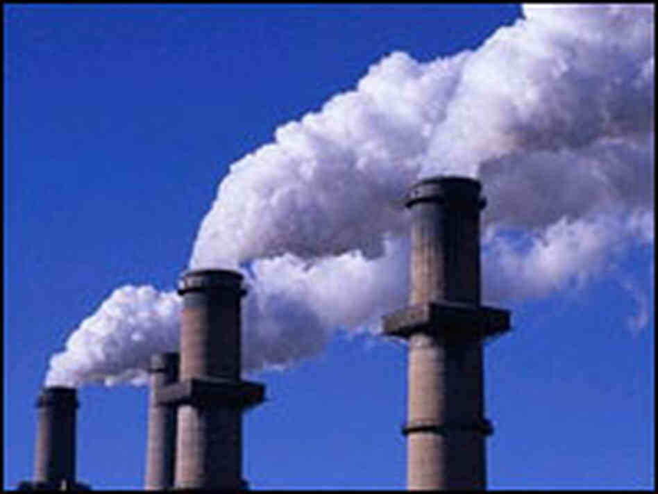 Smokestacks emit steam at a coal-burning power plant. Smokestacks emit steam at a coal-burning power plant.
